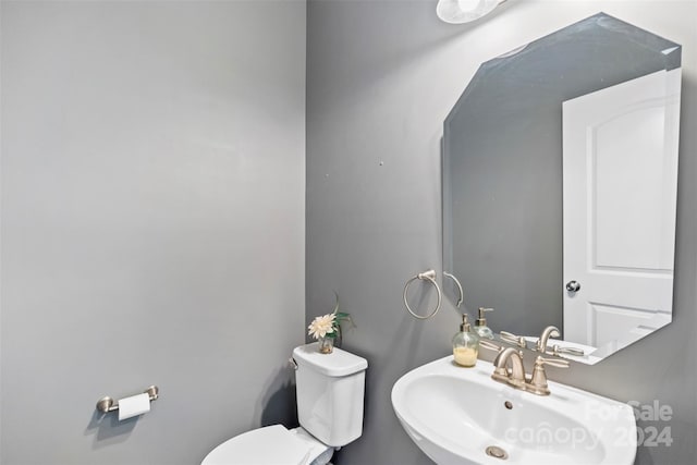 bathroom with sink and toilet