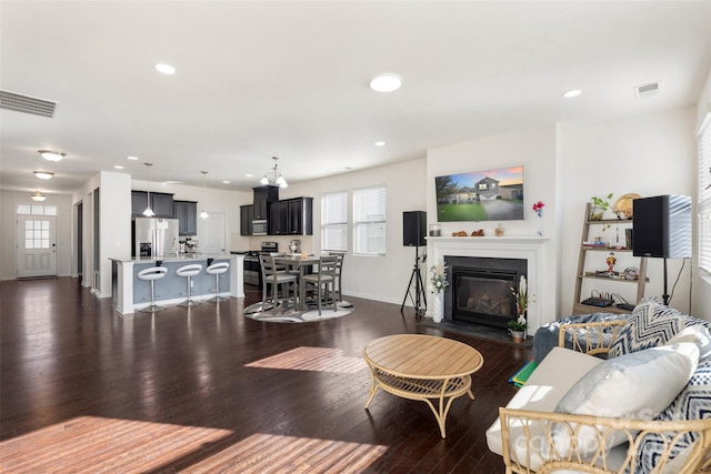 living room with dark hardwood / wood-style flooring