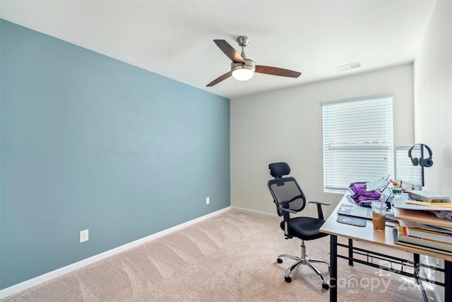 carpeted office with ceiling fan