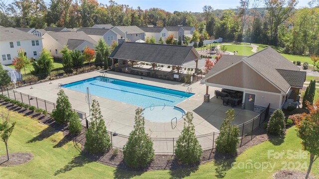 view of swimming pool featuring a gazebo, a patio area, and a lawn