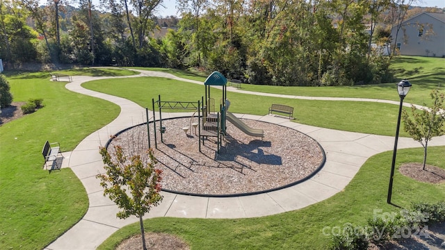 view of community with a playground and a yard