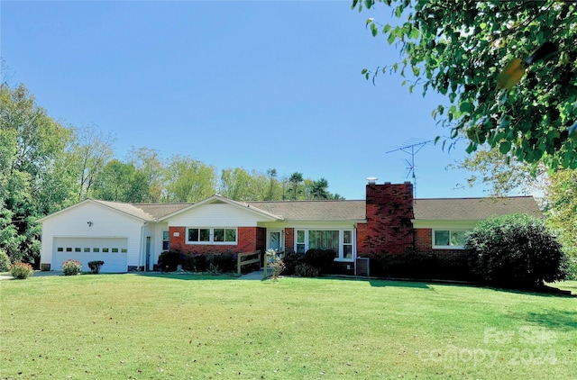 ranch-style house with a garage and a front lawn