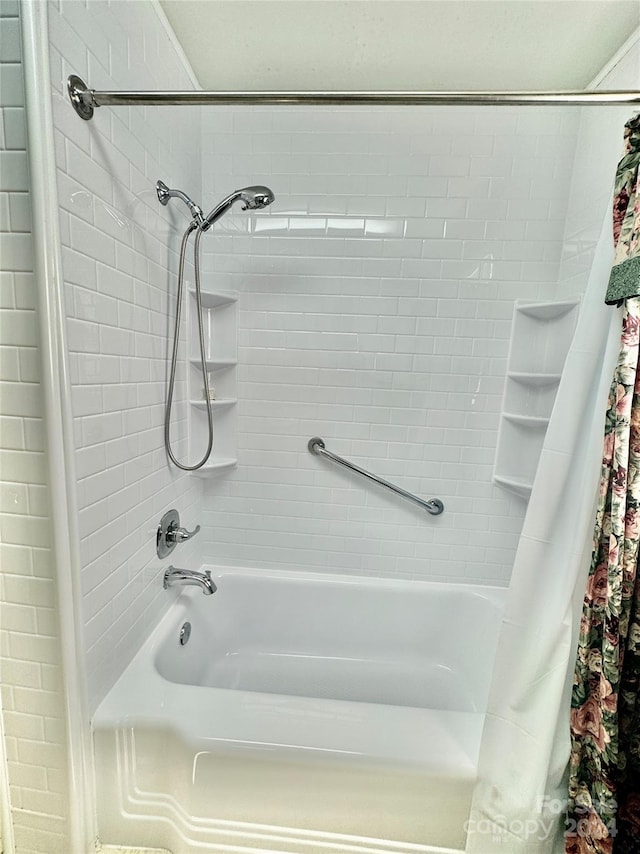 bathroom featuring shower / bath combo with shower curtain