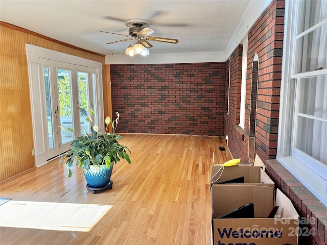 interior space with french doors and ceiling fan