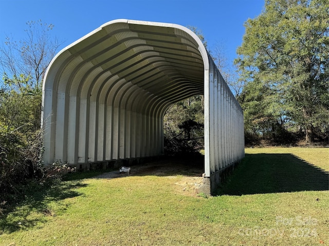 view of car parking with a yard