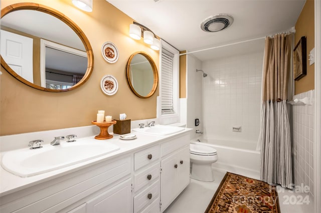 full bathroom featuring shower / bath combination with curtain, toilet, tile patterned floors, and vanity