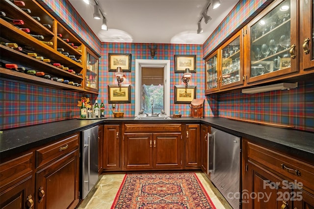 bar featuring wallpapered walls, fridge, wet bar, and a sink