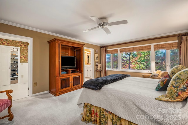 bedroom featuring light carpet, connected bathroom, crown molding, and baseboards