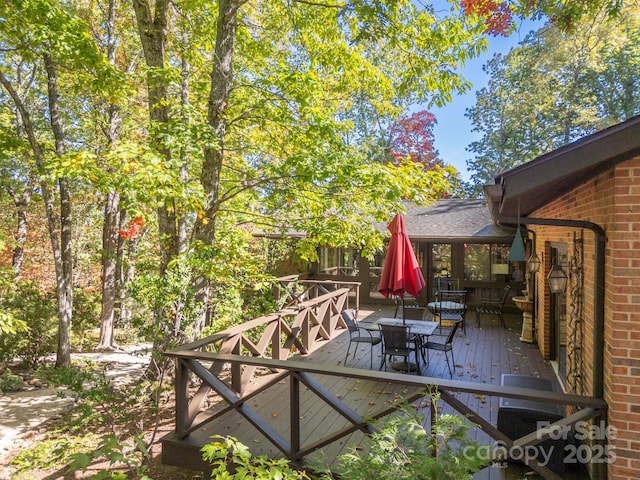 wooden deck with outdoor dining area