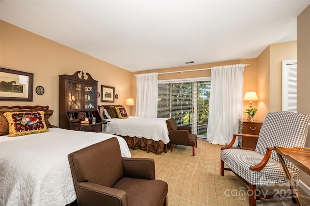 bedroom with visible vents and carpet floors