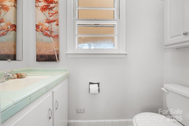 bathroom featuring vanity and toilet