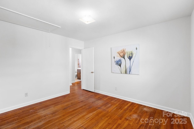 empty room featuring hardwood / wood-style flooring