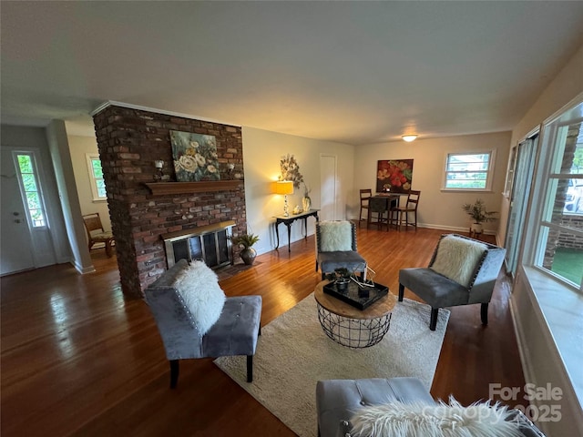 1727 Hartford Dr, Gastonia, NC 28052 - living area featuring wood finished floors, baseboards, and a fireplace