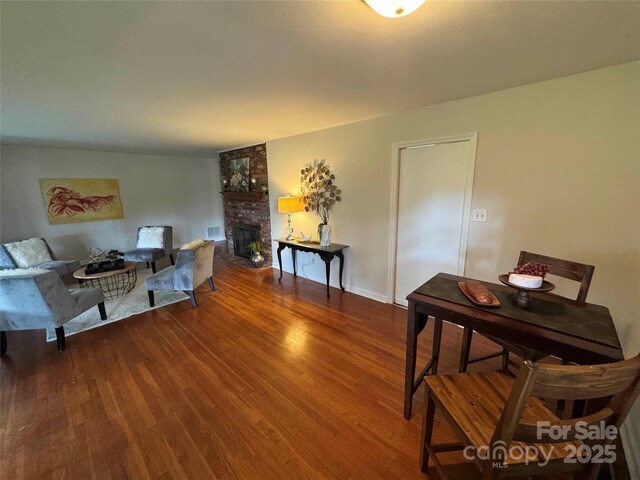 1727 Hartford Dr, Gastonia, NC 28052 - living area with wood finished floors and a large fireplace
