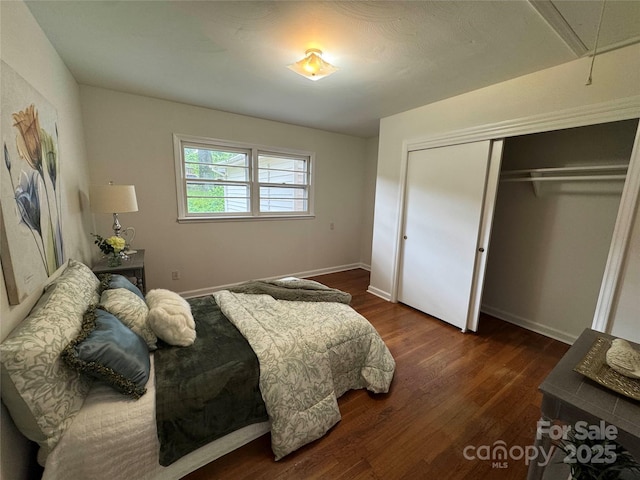 1727 Hartford Dr, Gastonia, NC 28052 - bedroom featuring attic access, a closet, dark wood-style flooring, and baseboards