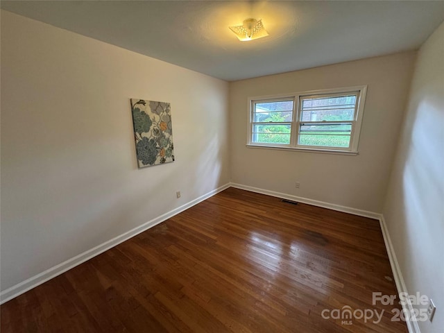 1727 Hartford Dr, Gastonia, NC 28052 - unfurnished room with baseboards and wood finished floors