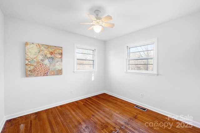 1727 Hartford Dr, Gastonia, NC 28052 - unfurnished room featuring baseboards, wood finished floors, and ceiling fan