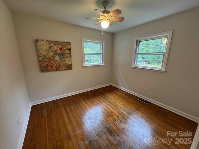 1727 Hartford Dr, Gastonia, NC 28052 - empty room featuring baseboards, dark wood-style floors, and ceiling fan