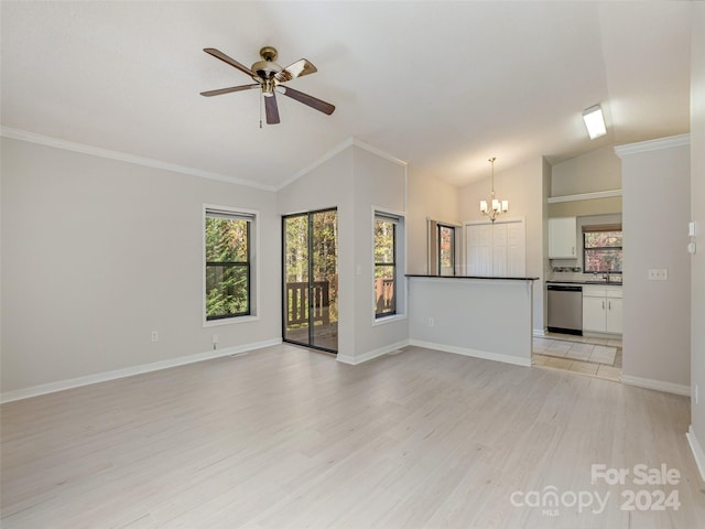 unfurnished living room with baseboards, ceiling fan with notable chandelier, light wood-style floors, and vaulted ceiling