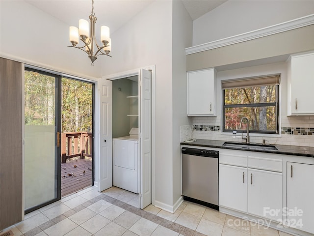 kitchen with washer / dryer, lofted ceiling, white cabinets, stainless steel dishwasher, and sink