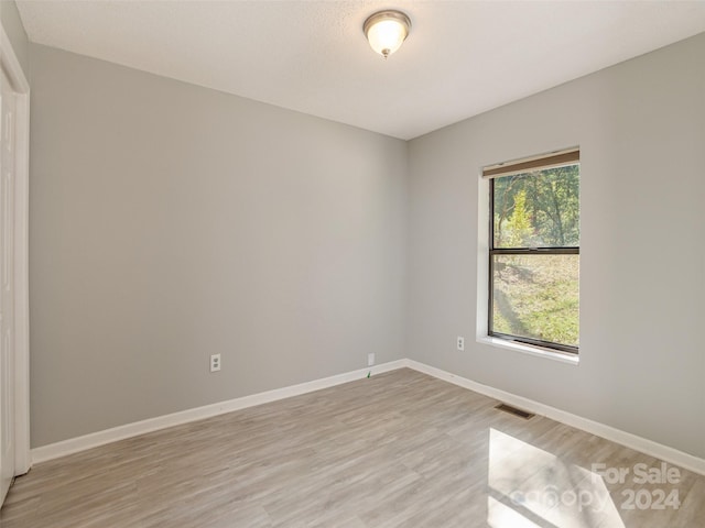 empty room with light wood-type flooring