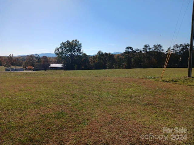 view of yard with a rural view