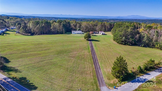 drone / aerial view featuring a mountain view and a rural view