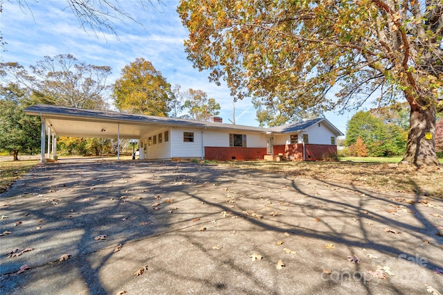 2926 Englewood Dr, Shelby, NC 28150 - view of front of home featuring a carport, a chimney, and aphalt driveway