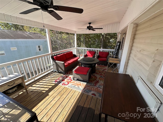 wooden terrace featuring ceiling fan