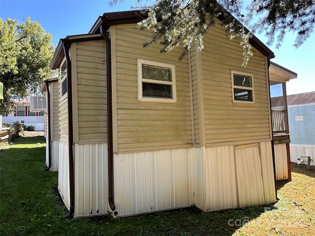 view of property exterior featuring a lawn