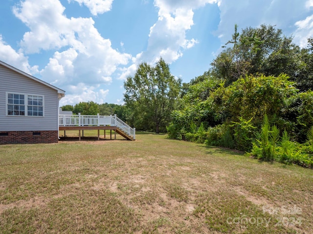 view of yard featuring a deck