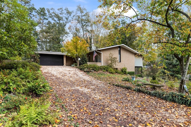 ranch-style home featuring a garage