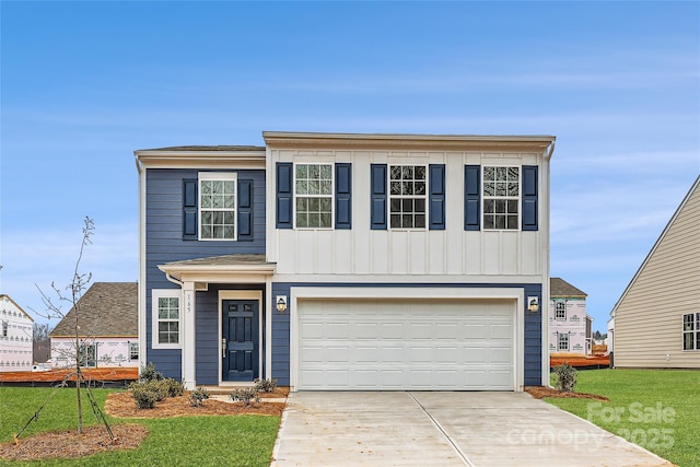 view of front facade featuring a garage and a front lawn