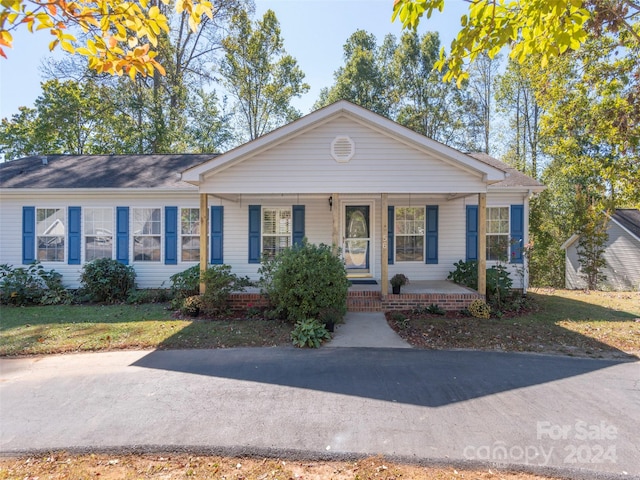 ranch-style home with covered porch