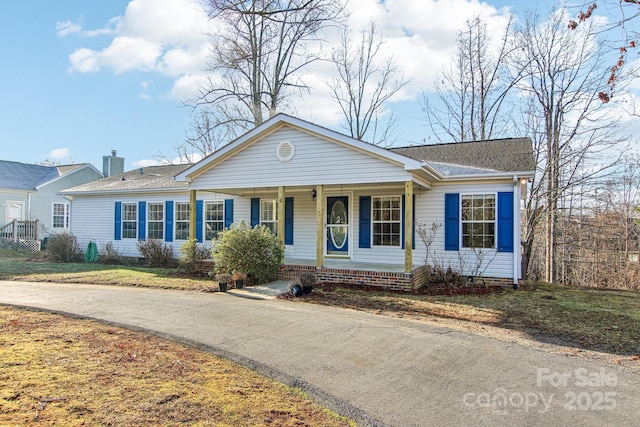 ranch-style home featuring covered porch