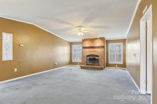 unfurnished living room featuring ornamental molding, vaulted ceiling, plenty of natural light, and a fireplace