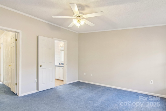 unfurnished bedroom with ornamental molding, carpet, connected bathroom, and a textured ceiling