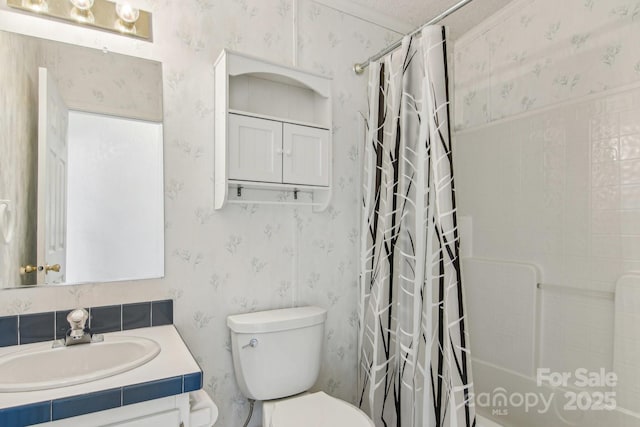 full bathroom featuring vanity, shower / bathtub combination with curtain, and toilet