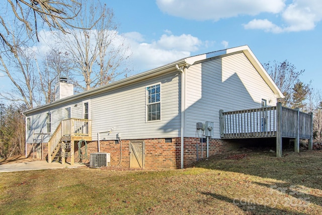 back of property featuring cooling unit, a lawn, and a deck