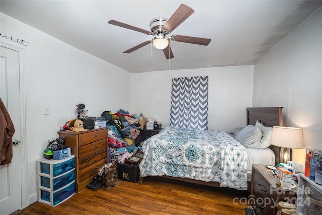 bedroom featuring ceiling fan and dark hardwood / wood-style flooring