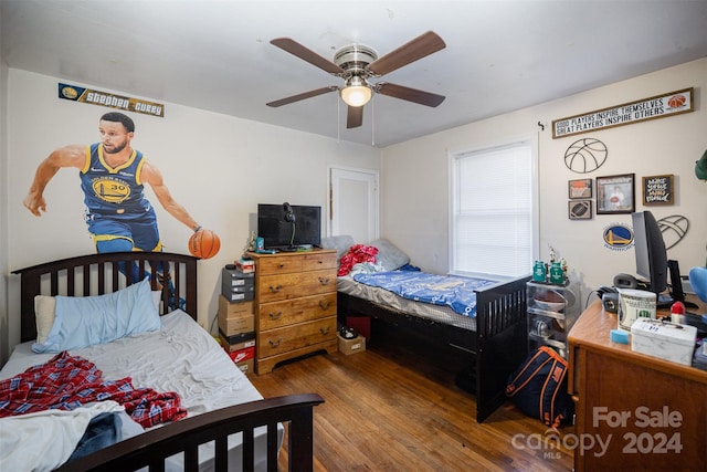 bedroom featuring ceiling fan and hardwood / wood-style floors