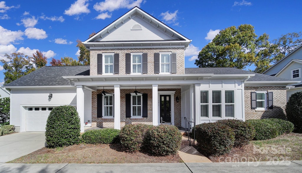 view of front of house with a porch and a garage