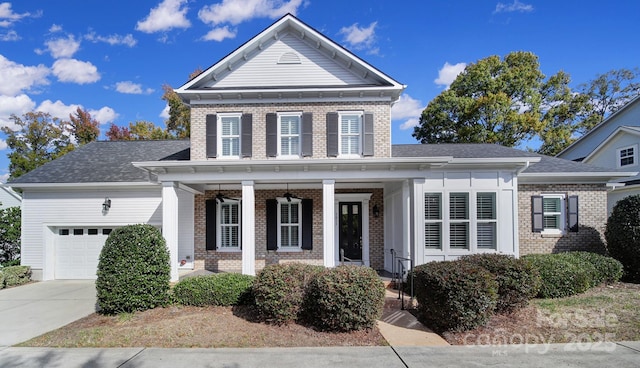 view of front of house with a porch and a garage