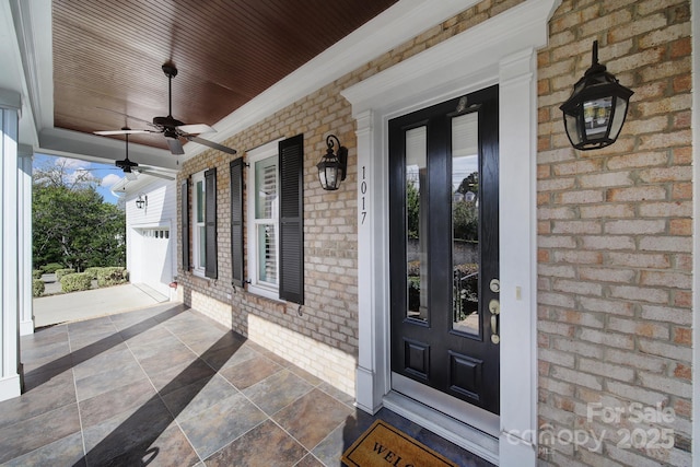 doorway to property with ceiling fan