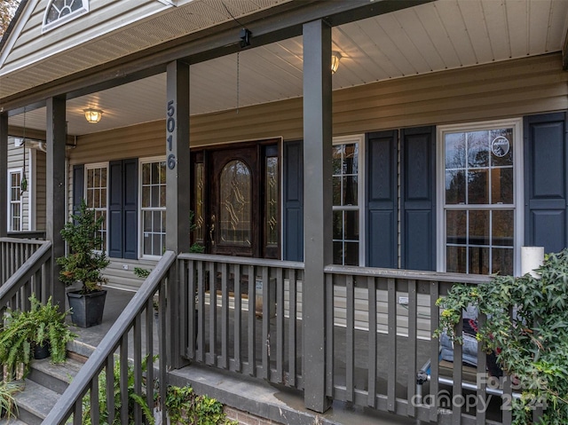 property entrance with covered porch