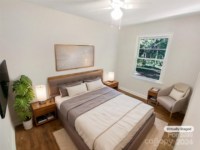 bedroom with dark wood-type flooring and ceiling fan