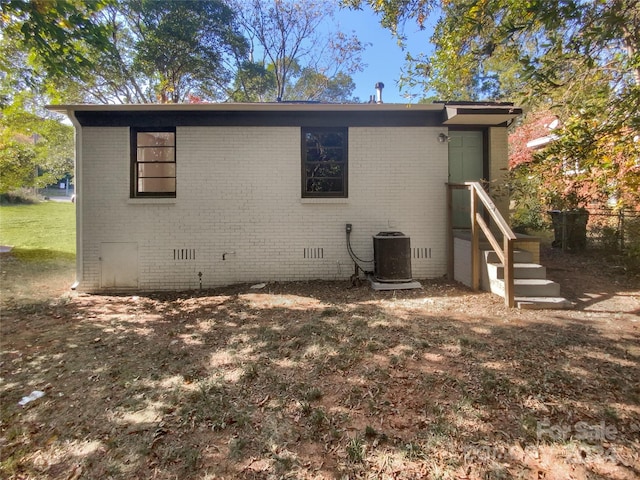 back of property with central AC unit