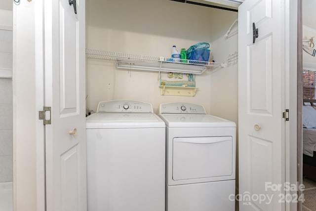 laundry room with separate washer and dryer