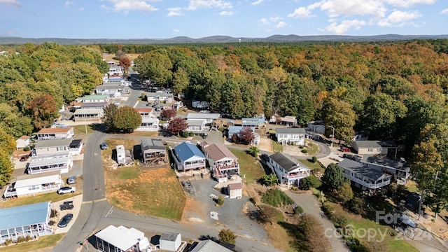 127 Lake View Dr, New London, NC 28127 - aerial overview of property's location featuring a heavily wooded area and a mountain backdrop