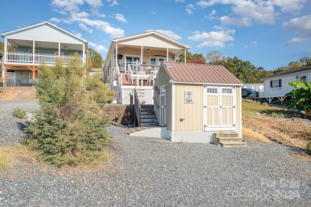 127 Lake View Dr, New London, NC 28127 - rear view of property with stairway, metal roof, and entry steps